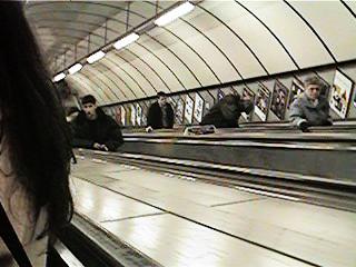 On escalators at Kings Cross going to the Northern Line